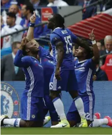  ?? ADRIAN DENNIS/AFP/GETTY IMAGES ?? Brazilian midfielder Willian, right, put Chelsea in front with a free kick in the fifth minute and from a penalty two minutes before halftime.