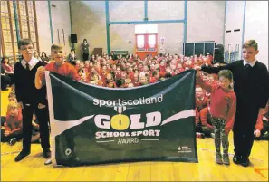  ??  ?? Left to right: Ryan Shields, Dylan Arkell, Niamh McSporran and Calum Ellis who helped Dalintober Primary obtain a gold award from sportscotl­and.