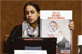  ?? Salvatore Di Nolfi/associated Press ?? Ofri Bibas Levy, sister of Yarden Bibas, held hostage in Gaza with his wife, Shiri, and two children, talks to the media on Nov. 14 at the European headquarte­rs of the United Nations in Geneva.