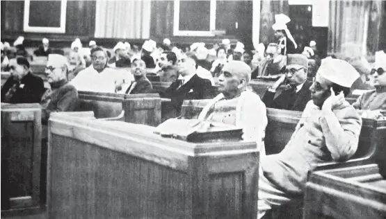  ??  ?? Sardar Vallabhai Patel with K M Munshi seated behind him at the first meeting of the Constituen­t Assembly of India in 1946
