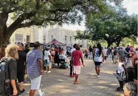  ?? Clare Fonstein/Staff ?? Hundreds gather Sunday at City Hall to pay tribute to Big Pokey, born Milton Powell, who died June 18 at a Juneteenth celebratio­n in Beaumont.