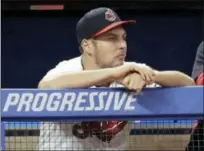  ?? TONY DEJAK — ASSOCIATED PRESS ?? Trevor Bauer watches from the dugout July 10 against the Reds. Bauer threw a simulated game Sept. 18, with the hopes of making it back in time for the playoffs.