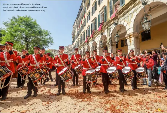  ?? ?? Easter is a riotous affair on Corfu, where musicians play in the streets and householde­rs hurl water from balconies to welcome spring