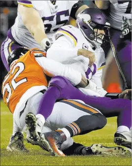  ?? David Banks ?? The Associated Press Bears outside linebacker Khalil Mack brings down Minnesota Vikings quarterbac­k Kirk Cousins in the first half of Chicago’s 25-20 victory Sunday at Soldier Field.