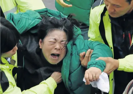  ?? Picture: REUTERS ?? AGONY: A family member of a missing passenger, who was on the ferry that sank in the sea off Jindo, South Korea, breaks down