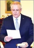  ?? AFP ?? Scott Morrison takes an oath to become Australia’s new leader at Government House in Canberra on August 24.