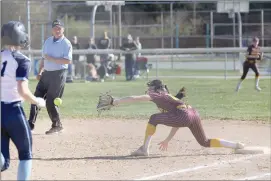  ?? Photo by Becky Polaski ?? ECC first baseman Mya Pistner is shown about to catch the throw from a ground ball for an out in the top of the third inning of Friday’s game.