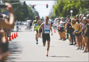  ?? DAVID WITTE/NEWS-SENTINEL ?? Above: Pat Joseph (308) carries a lead down the stretch of the Elite Men's race at the Lodi Mile on Sunday at Hutchins Street Square. Below: The six-woman field of the Elite Women's race rounds the first turn.