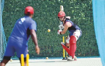  ?? Virendra Saklani/Gulf News ?? Christophe­r Carter of Hong Kong bats during a nets session at the ICC Academy ground in ■ Dubai. Hong Kong will face Pakistan in their opening Asia Cup match.