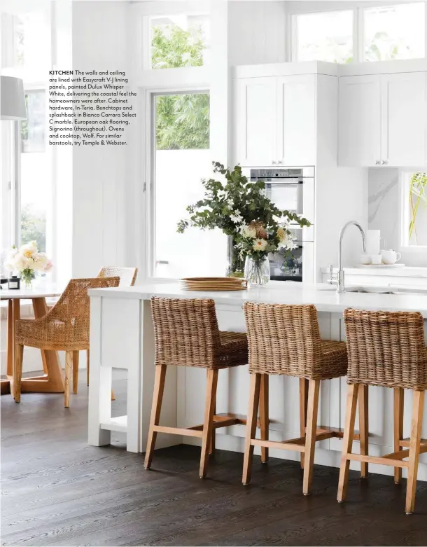  ??  ?? KITCHEN The walls and ceiling are lined with Easycraft V-J lining panels, painted Dulux Whisper White, delivering the coastal feel the homeowners were after. Cabinet hardware, In-Teria. Benchtops and splashback in Bianco Carrara Select C marble. European oak flooring, Signorino (throughout). Ovens and cooktop, Wolf. For similar barstools, try Temple & Webster.