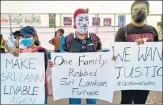  ?? AFP ?? Protesters display placards during an ongoing anti-government demonstrat­ion in Colombo on Wednesday.