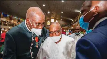  ??  ?? Former GMD of NNPC, Dr. Jackson Gaius-Obaseki and former President Olusegun Obasanjo during the knighthood investitur­e service.