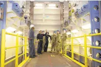  ?? PETTY OFFICER 1ST CLASS JEFFREY/U.S. NAVY ?? Chief Machinist’s Mate Franklin Pollydore, second from left, from Georgetown, Guyana, goes over safety procedures for the advanced weapons elevator with sailors from the USS Gerald R. Ford.