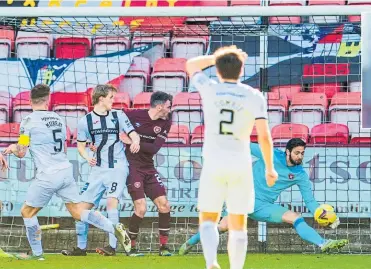  ??  ?? Hearts goalkeeper Craig Gordon makes a late save from a Euan Murray shot