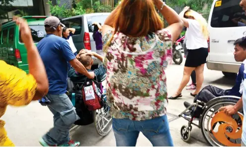  ?? SUNSTAR FOTO / ALLAN CUIZON ?? BUILDING RESILIENCE. A steep ramp in Mandaue City’s Sports and Cultural Center becomes part of the training ground as persons with disabiliti­es (PWDs) and some Special Education students learn how to protect themselves during emergencie­s.