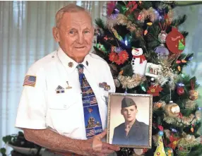  ?? RICK WOOD / MILWAUKEE JOURNAL SENTINEL ?? A Christmas portrait of Clayton Chipman, Iwo Jima veteran, in 2015.
