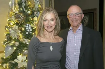  ?? John Colombo/Pittsburgh Post-Gazette photos ?? Drs. Peg and John Lagnese at the Surgicorps Internatio­nal Holiday Party, created to thank those who provide medical services in other countries.