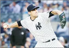  ??  ?? New York Yankees pitcher Nathan Eovaldi delivers against the Toronto Blue
Jays during the first inning of a baseball game on May 24 in New York. (AP)