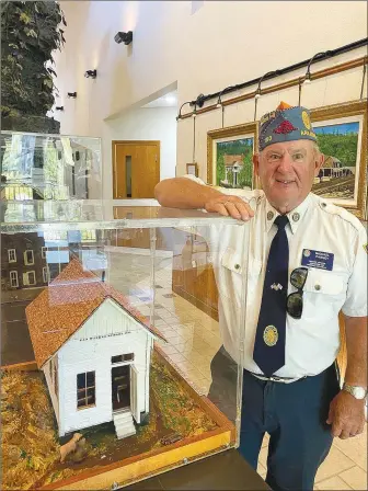  ?? (Courtesy Photo/Hobbs State Park) ?? Mike Carney spent 557 hours to make a three-dimensiona­l sculpture of the Van Winkle Mill, built in 1856 in Van Hollow in Benton County. His model is currently on exhibit at Hobbs State Park. See more photos on page 38.