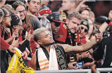  ?? ASSOCIATED PRESS FILE PHOTO ?? Josef Martinez takes a photo with fans after defeating the New York Red Bulls in an MLS playoff game Nov. 25 in Atlanta.