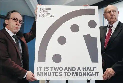  ?? CAROLYN KASTER / THE ASSOCIATED PRESS ?? Lawrence Krauss, theoretica­l physicist, chair of the Bulletin of the Atomic Scientists†Board of Sponsors, left, and Thomas Pickering, co- chair of the Internatio­nal Crisis Group, display the Doomsday Clock last Thursday.