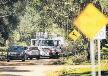  ?? JACOB LANGSTON/STAFF PHOTOGRAPH­ER ?? A Duke Energy truck works along Ibis Road in Longwood as crews continue to try to restore power after Hurricane Irma.