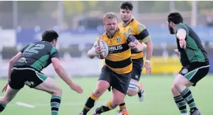  ?? MIKE JONES ?? Flanker Jamie Price of Aberdare cuts through, watched by teammate Lewis Young, son of Wasps head coach Dai Young