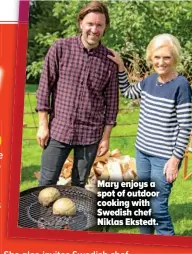  ??  ?? Mary enjoys a spot of outdoor cooking with Swedish chef Niklas Ekstedt.