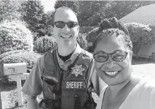  ?? Janelle Bynum / Associated Press ?? Oregon state Rep. Janelle Bynum takes a selfie with a county sheriff's officer after he stopped her in Clackamas, Ore.