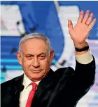  ?? AP ?? Israeli Prime Minister Benjamin Netanyahu waves to his supporters after the first exit poll results for the Israeli parliament­ary elections at his Likud party’s headquarte­rs in Jerusalem.