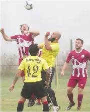  ??  ?? Spencer Nebel rises above his opponent in the Cup game between Bunyip and ETA Buffalo as the FFA Cup got underway at the Bunyip Rec Reserve.