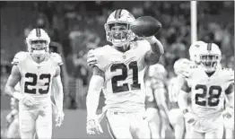  ?? LYNNE SLADKY/AP ?? Bills safety Jordan Poyer holds the ball after making an intercepti­on against the Dolphins.