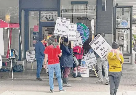  ?? Patrick Danner/Staff ?? Starbucks workers picket in downtown San Antonio in November. Starbucks appears to be playing the long game.