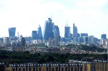  ??  ?? Constructi­on work is seen on high-rise office blocks in the financial district of London. The government’s proposal for a new financial services arrangemen­t post-Brexit will effectivel­y make it more difficult for Britain’s banks, insurers and asset...