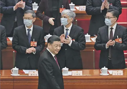  ?? Noel Celis AFP/Getty Images ?? PRESIDENT Xi Jinping arrives at Friday’s session of the National People’s Congress, whose members endorsed him for a third term by a vote of 2,952 to 0. Chinese leaders had traditiona­lly left office after two terms. Xi and other winners are believed to have run unopposed.