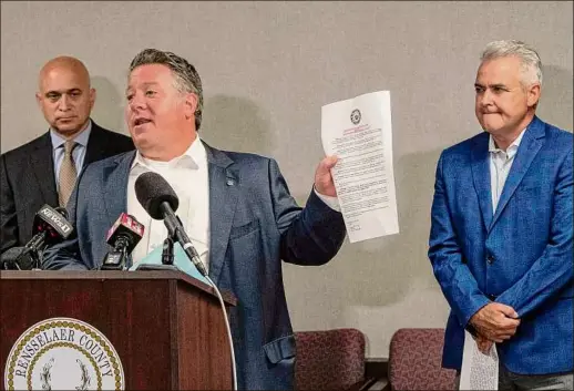  ?? Photos by Lori Van Buren / Times Union ?? Albany County Executive Daniel Mccoy speaks at the Rensselaer County Office Building on Friday in Troy, alongside Rensselaer County Executive Steve Mclaughlin, right, and New York State Associatio­n of Counties Executive Director Stephen Acquario.