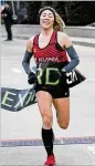  ??  ?? Ex-University of Georgia runner Bridget Lyons won the women’s division of the Extra Yard 5K.