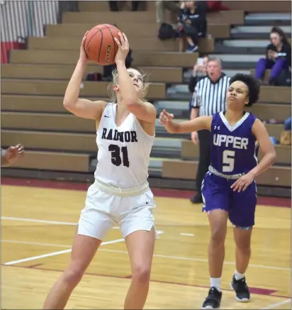  ?? PETE BANNAN – MEDIANEWS GROUP ?? Radnor senior Ellie Mueller breaks the school’s all-time scoring record with her 1,226th point in the first quarter against Upper Darby Tuesday.