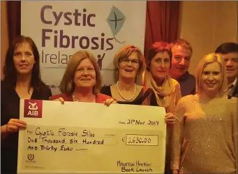  ??  ?? Sligo Author Maureen Harkin donates cheque to the Sligo branch of Cystic Fibrosis last week.