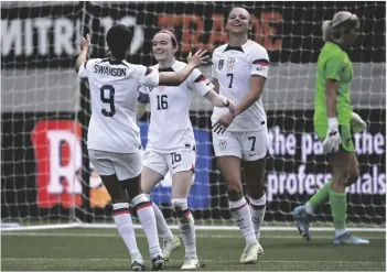  ?? ANDREW CORNAGA/PHOTOSPORT VIA AP ?? Rose Lavelle of the U.S. (second from left) celebrates with teammates after scoring against New Zealand during their women’s internatio­nal soccer friendly game in Auckland, New Zealand, on Jan. 21.