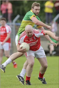  ??  ?? Kilcoole’s Daniel Kavanagh puts pressure on Knockanann­a’s Patrick O’Keefe during the JAFC in Pearse’s Park, Arklow.