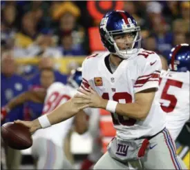  ?? AP FILE ?? Giants’ Eli Manning throws during the first half of loss to Packers last Sunday.