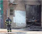  ?? COLIN BOYLE / MILWAUKEE JOURNAL SENTINEL ?? Milwaukee Fire Department crews respond to a fire Friday at Aguilar's Welding, 1334 W. National Ave.