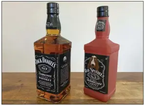  ?? (AP) ?? A bottle of Jack Daniel’s Tennessee Whiskey is displayed next to a Bad Spaniels dog toy in Arlington, Va.