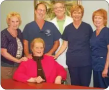  ??  ?? Honoree Faith Buck, seated, surrounded by colleagues from the Center for Women’s Health. From left, standing, are Marie Martin, Dr. Neil D. Bluebond, DO, Dr. Lester A. Ruppersber­ger, DO, Maureen Strange and Eileen Bartleson.