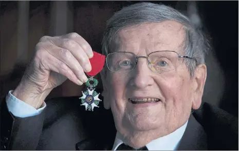  ??  ?? HAROLD CURRIE: The war hero shows off his medal after the ceremony in Glasgow. Picture: Martin Shields