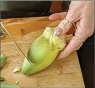  ??  ?? You get to the artichoke heart by peeling off all of the outer leaves until you get to light yellow.