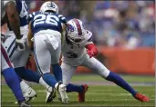  ?? PHOTOS BY ADRIAN KRAUS — THE ASSOCIATED PRESS ?? Bills safety Damar Hamlin (3) tackles Colts running back Evan Hull (26) during the first half of a preseason game in Orchard Park, N.Y., on Saturday.
