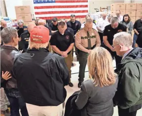  ?? GEORGE WALKER IV/USA TODAY NETWORK - TENNESSEE ?? Gov. Bill Lee, from bottom left, leads a prayer with President Donald Trump, U.S. Sens. Marsha Blackburn and Lamar Alexander and first responders at Jefferson Avenue Church of Christ in Cookeville on March 6.