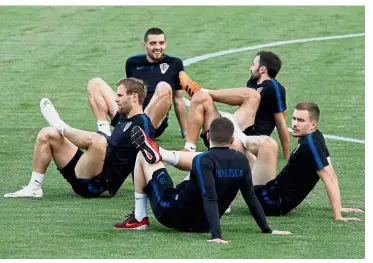  ??  ?? Enough energy: The Croatian team warming up before their training session yesterday. — Reuters